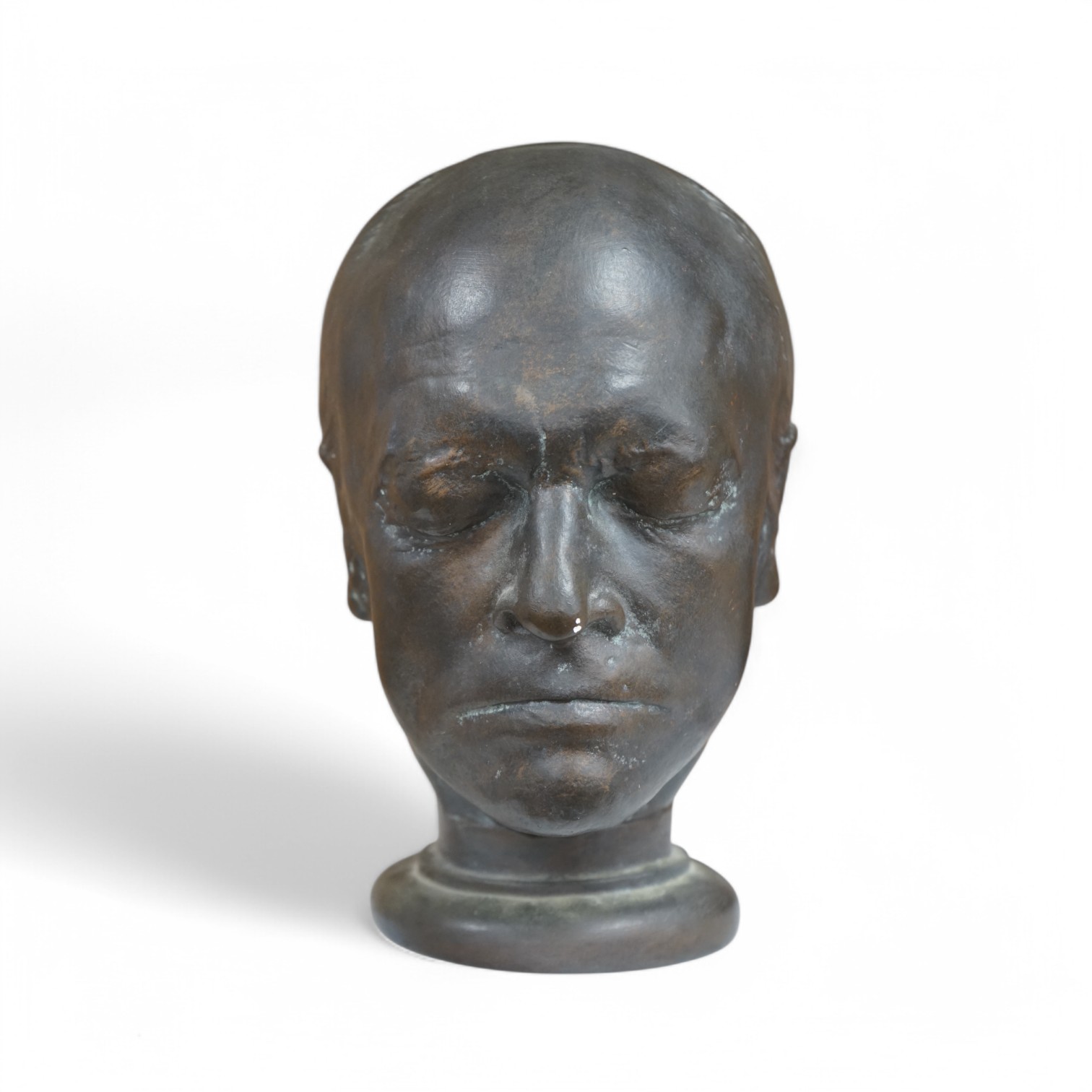 After James Deville, a bronzed plaster bust of William Blake, 28cm high. Condition - bronzed paint scratch to nose showing plaster